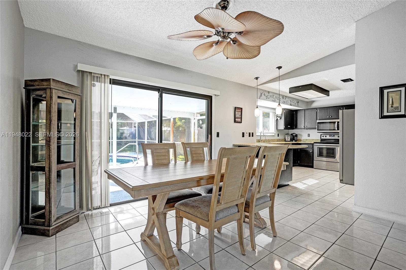 2252 Southeast Rainier Road Port St. Lucie, FL 34952 - Photo 12 of 52 a dining room with furniture and window