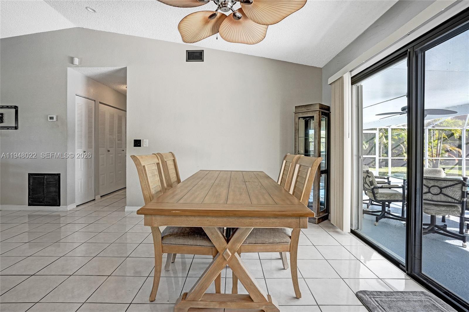 2252 Southeast Rainier Road Port St. Lucie, FL 34952 - Photo 15 of 52 a view of a dining room with furniture wooden floor and chandelier