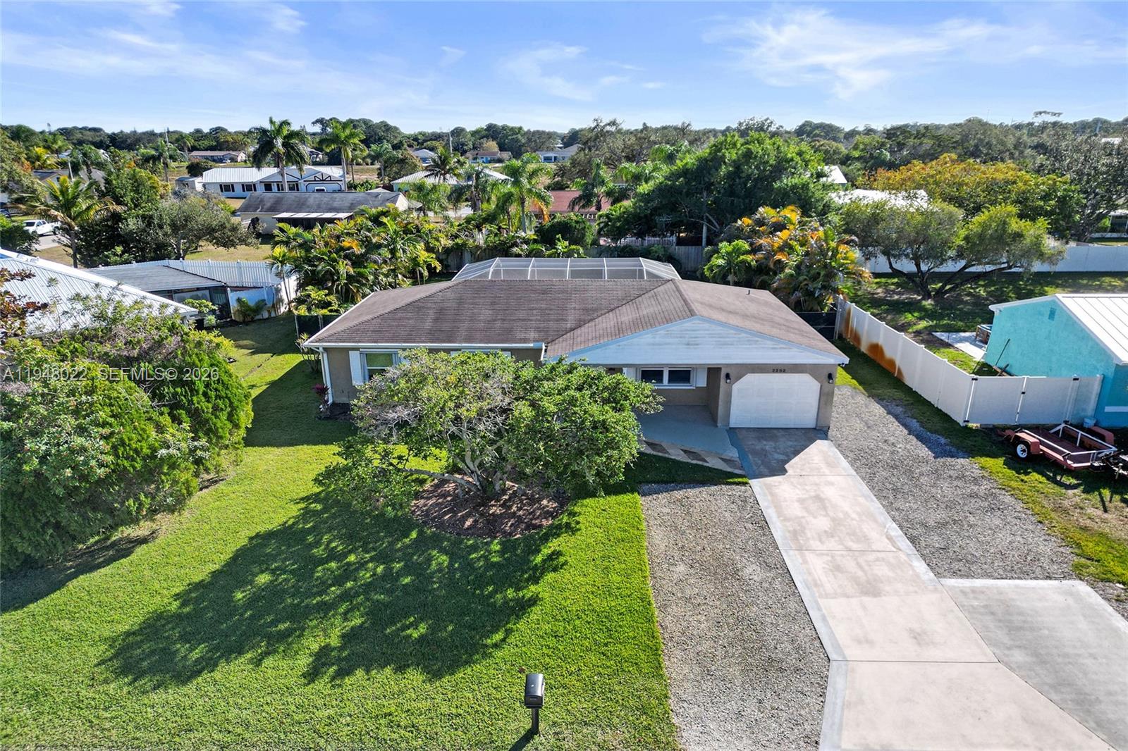 2252 Southeast Rainier Road Port St. Lucie, FL 34952 - Photo 2 of 52 an aerial view of a house with a garden