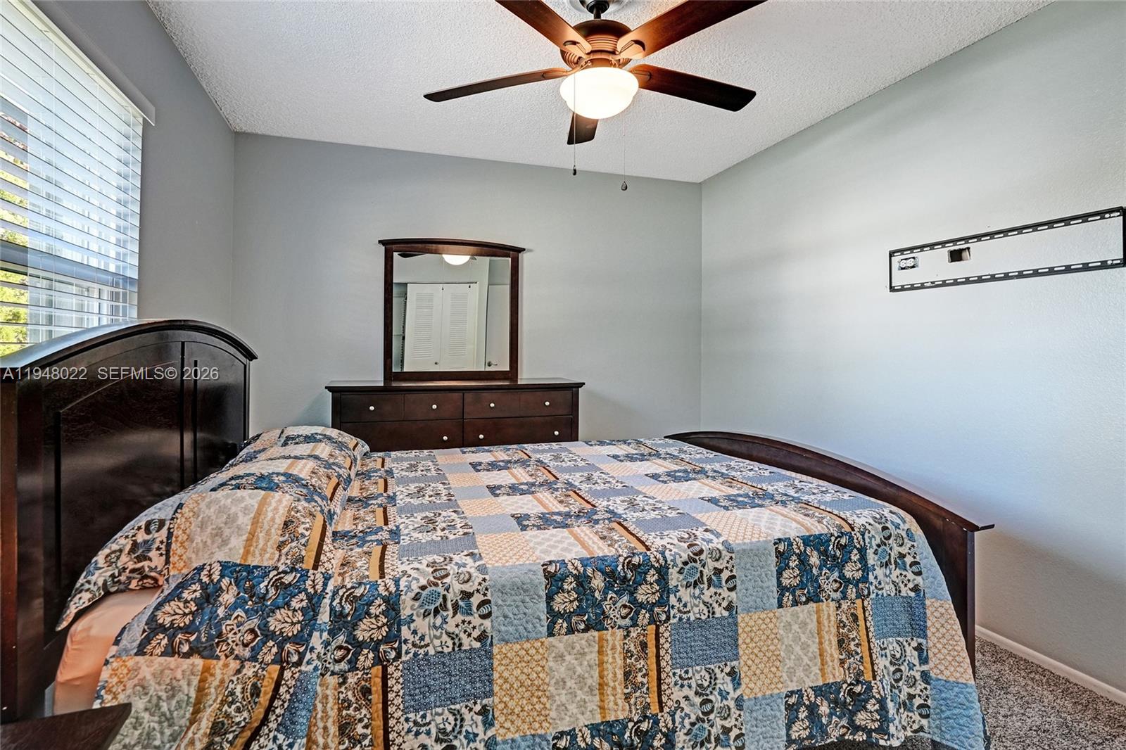 2252 Southeast Rainier Road Port St. Lucie, FL 34952 - Photo 31 of 52 a bedroom with a bed and a dresser