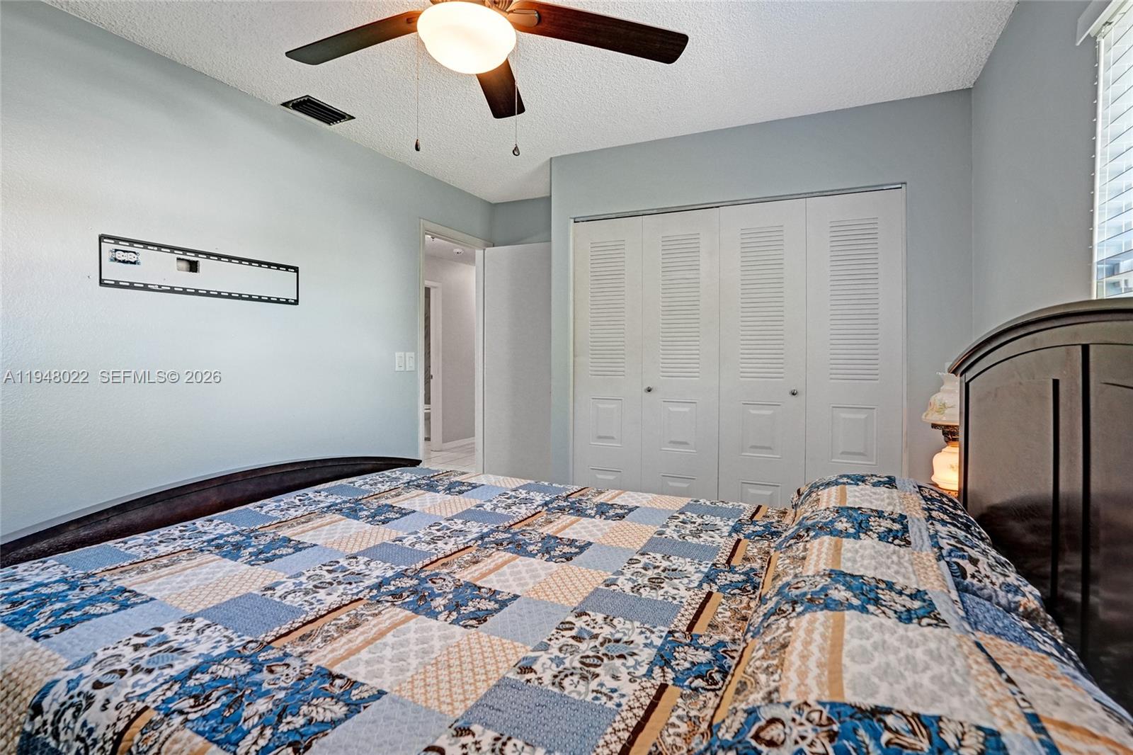 2252 Southeast Rainier Road Port St. Lucie, FL 34952 - Photo 33 of 52 a bedroom with a large bed and a window