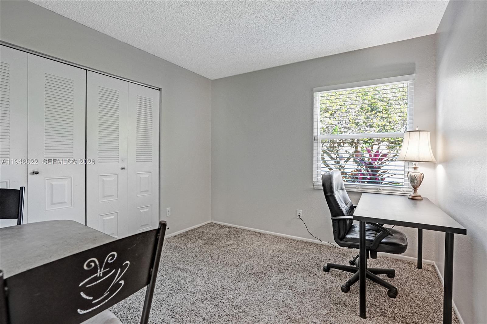 2252 Southeast Rainier Road Port St. Lucie, FL 34952 - Photo 36 of 52 a view of a workspace with furniture and a window