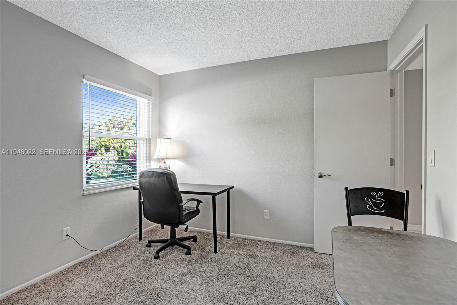 2252 Southeast Rainier Road Port St. Lucie, FL 34952 - Photo 37 of 52 a workspace with furniture and a window