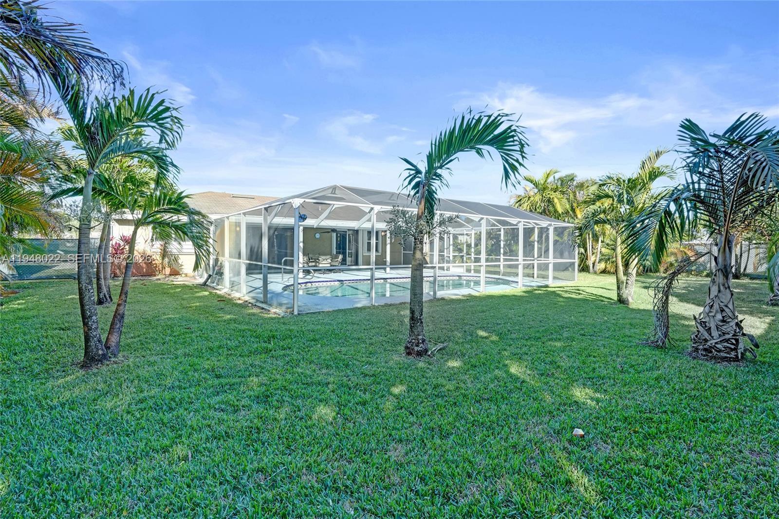2252 Southeast Rainier Road Port St. Lucie, FL 34952 - Photo 4 of 52 a view of a house with a yard