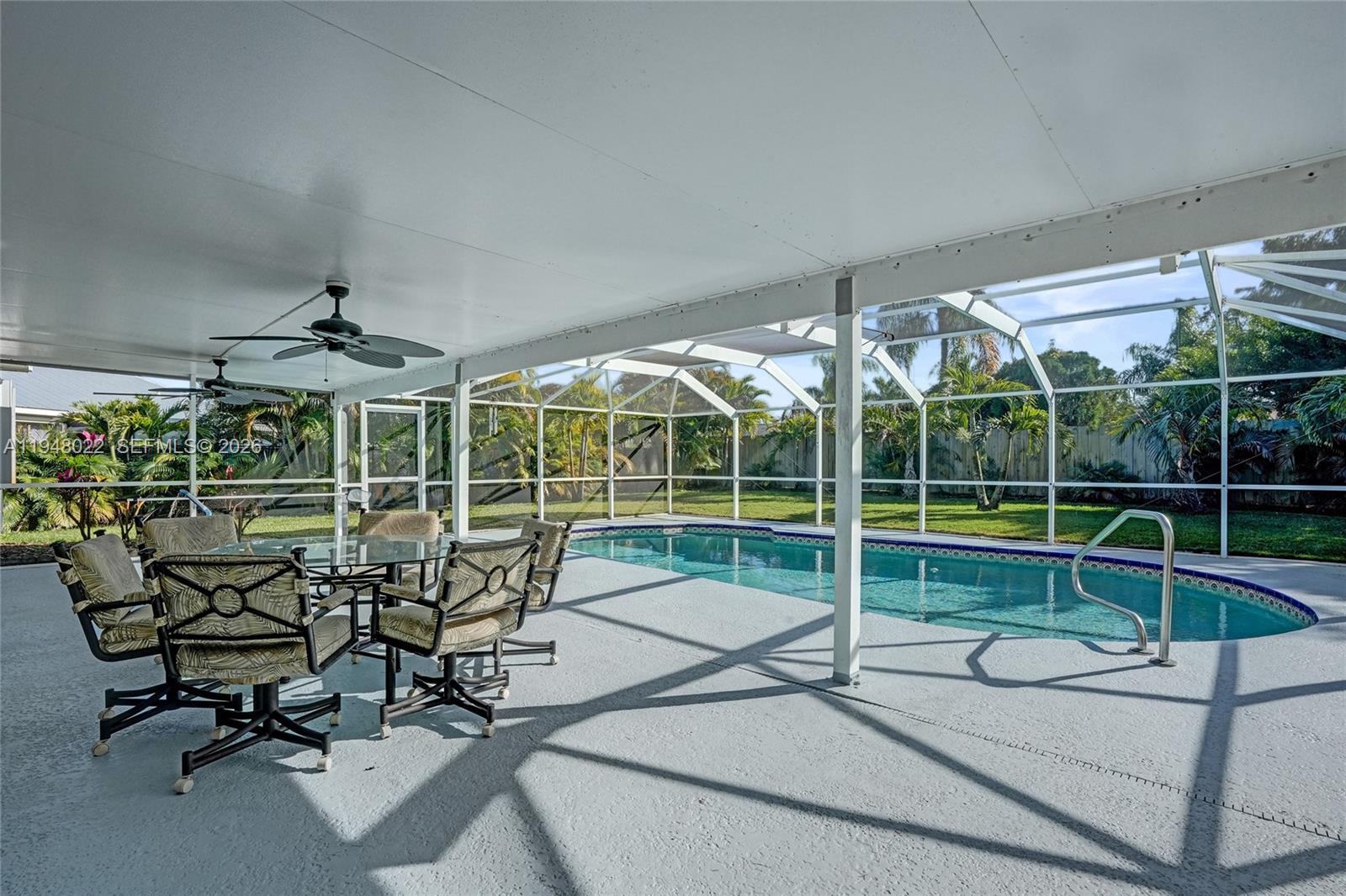 2252 Southeast Rainier Road Port St. Lucie, FL 34952 - Photo 41 of 52 a view of a chair and tables in the patio