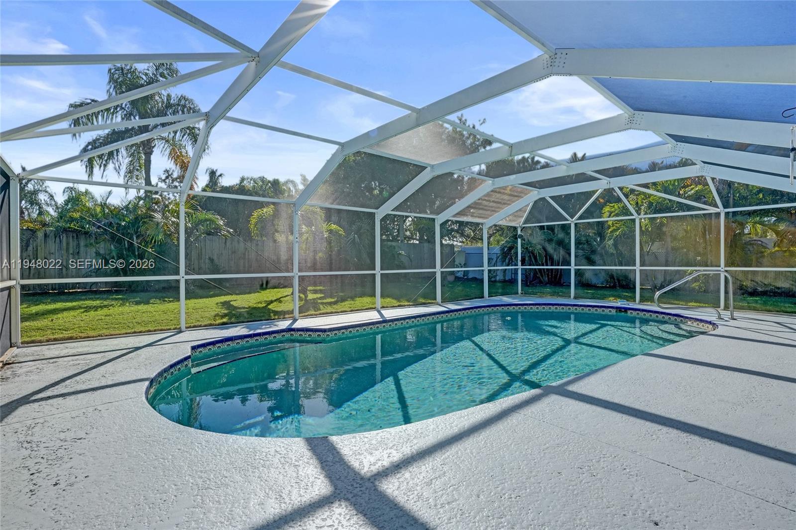 2252 Southeast Rainier Road Port St. Lucie, FL 34952 - Photo 44 of 52 a view of a backyard with a swimming pool