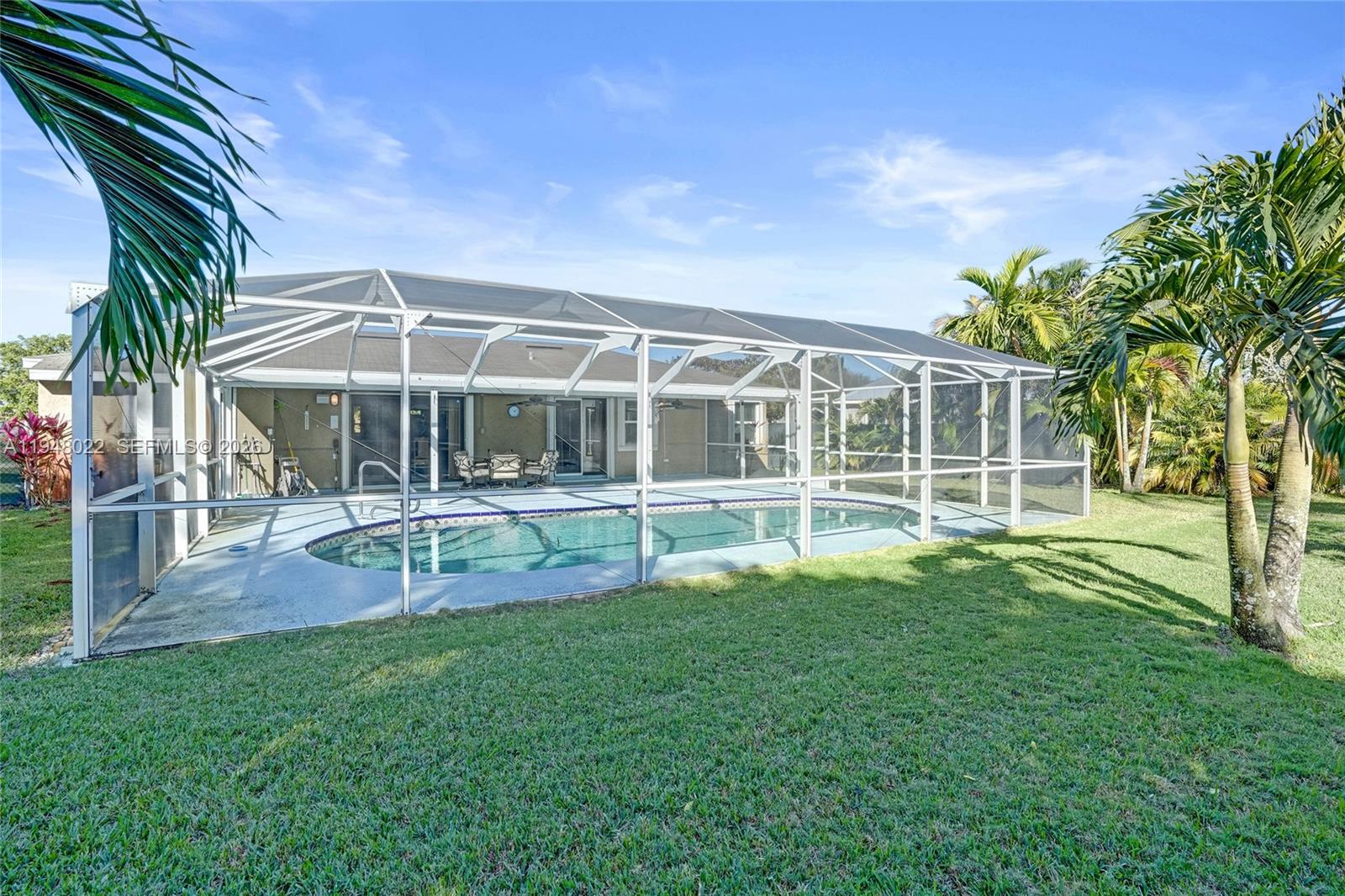 2252 Southeast Rainier Road Port St. Lucie, FL 34952 - Photo 48 of 52 a view of a house with backyard and sitting area