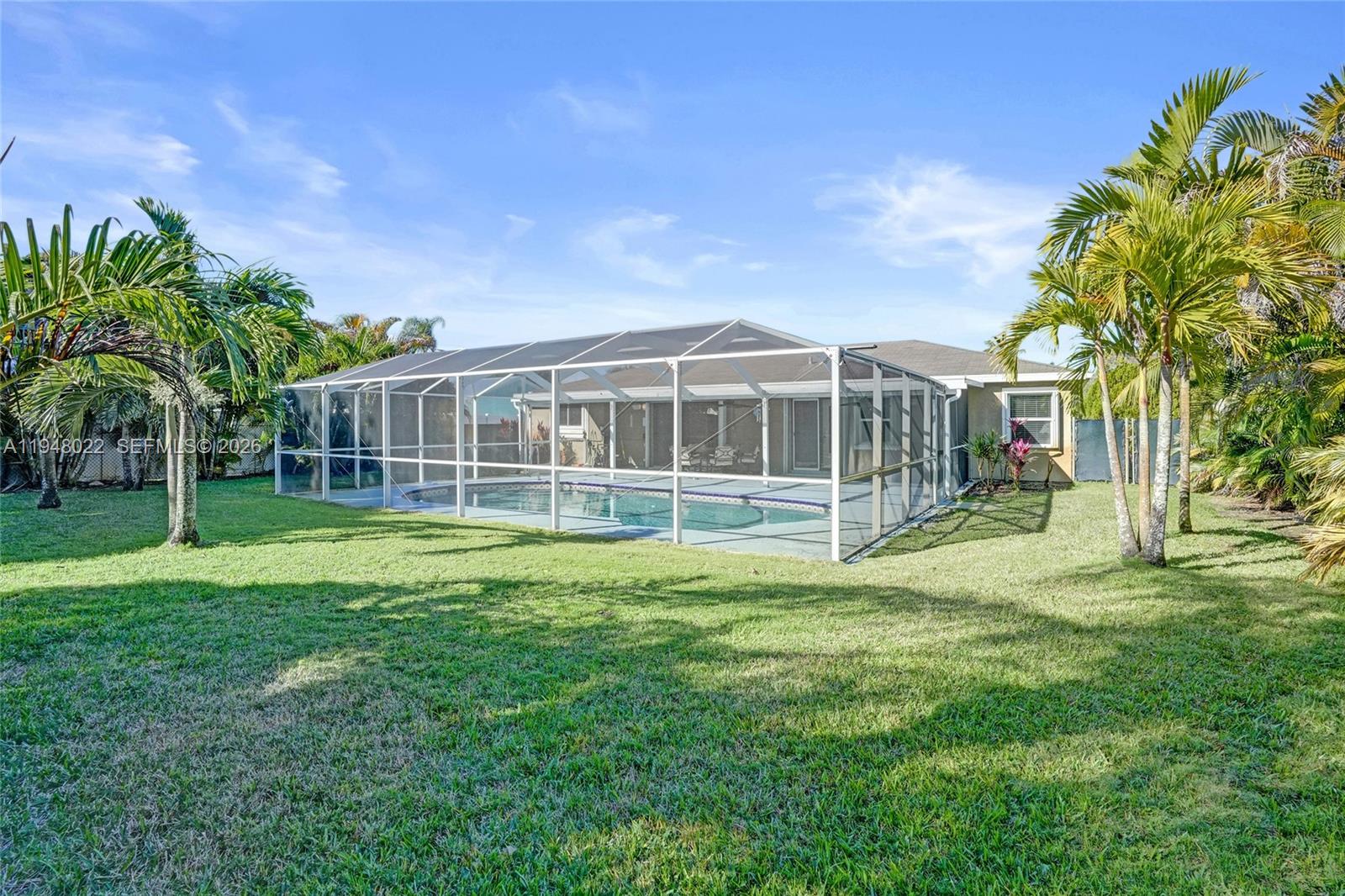 2252 Southeast Rainier Road Port St. Lucie, FL 34952 - Photo 50 of 52 a view of a house with a yard and sitting area