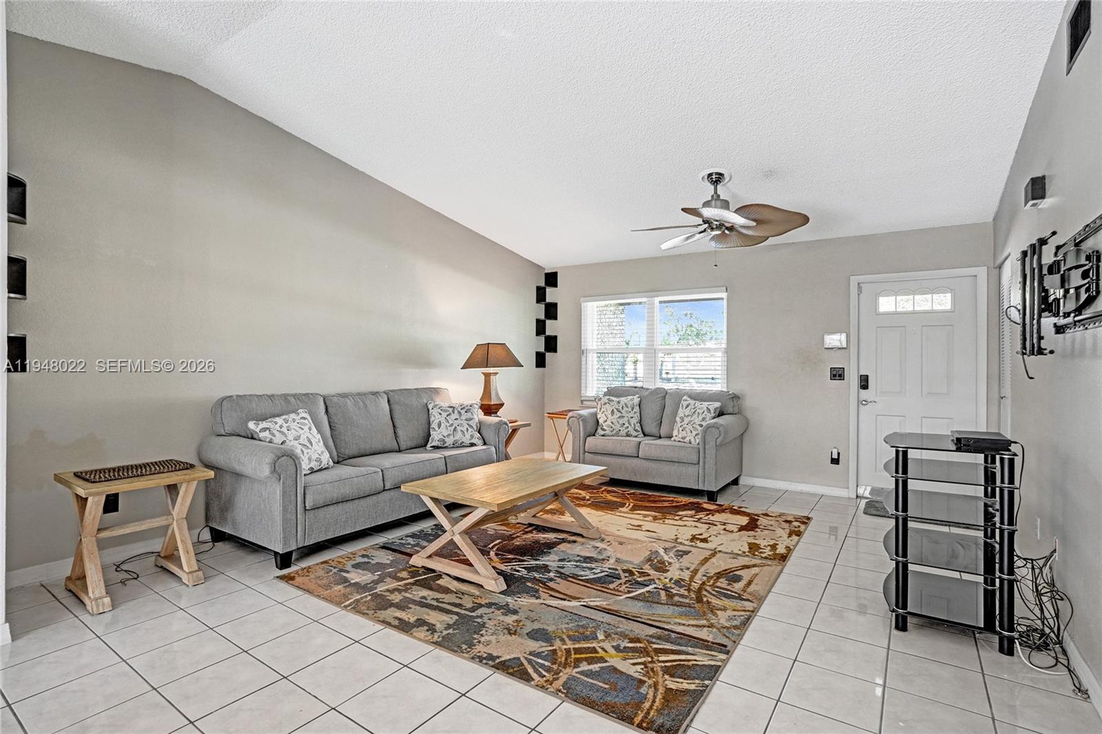 2252 Southeast Rainier Road Port St. Lucie, FL 34952 - Photo 5 of 52 a living room with furniture and wooden floor