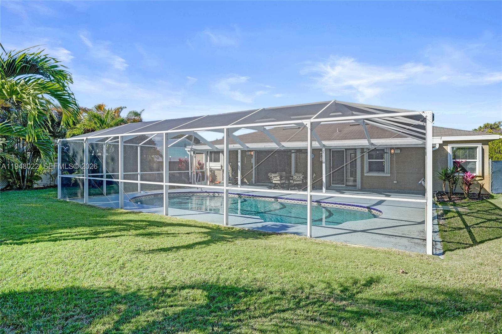 2252 Southeast Rainier Road Port St. Lucie, FL 34952 - Photo 51 of 52 a view of a house with backyard and porch