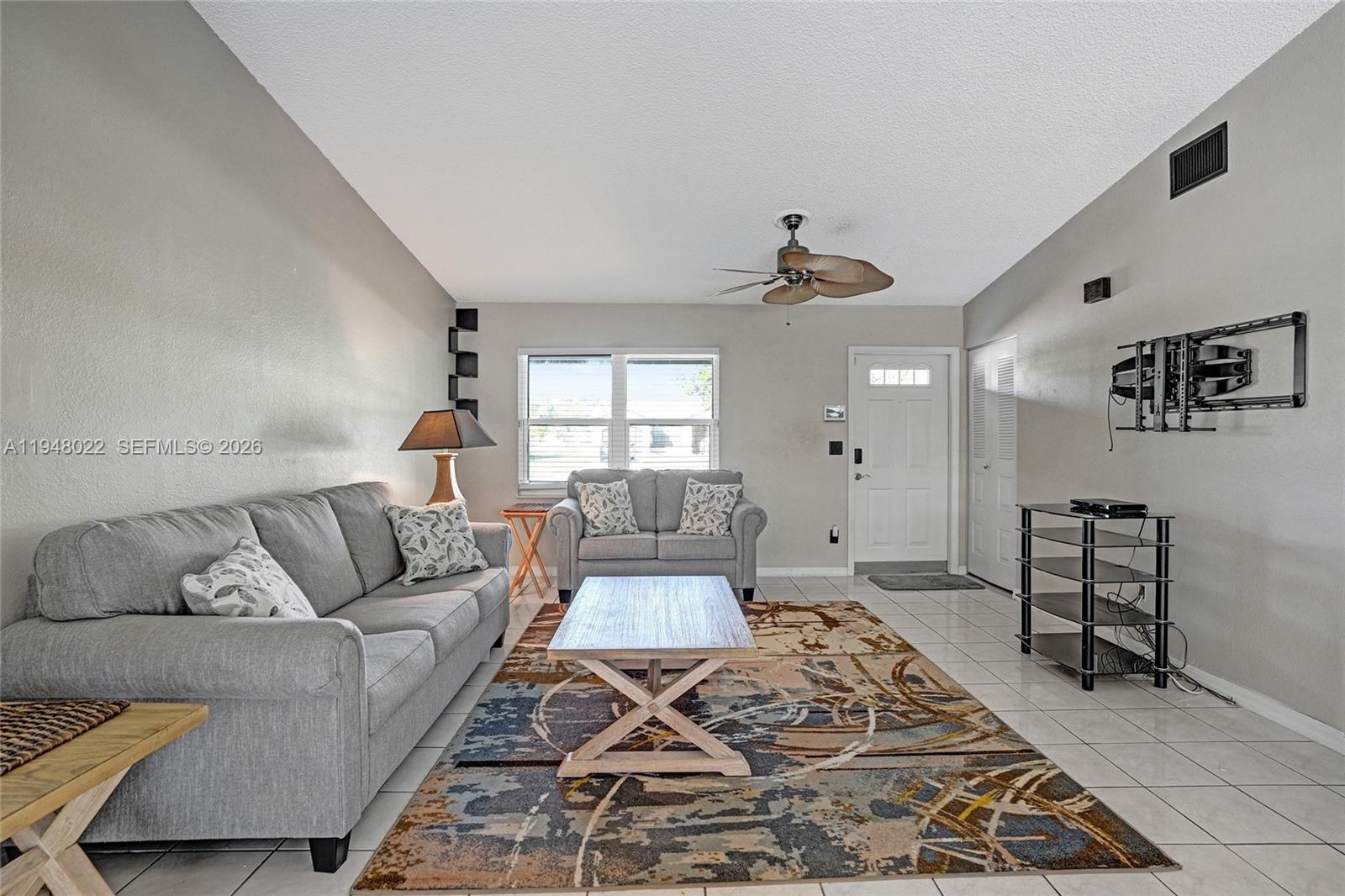 2252 Southeast Rainier Road Port St. Lucie, FL 34952 - Photo 6 of 52 a living room with furniture and a rug