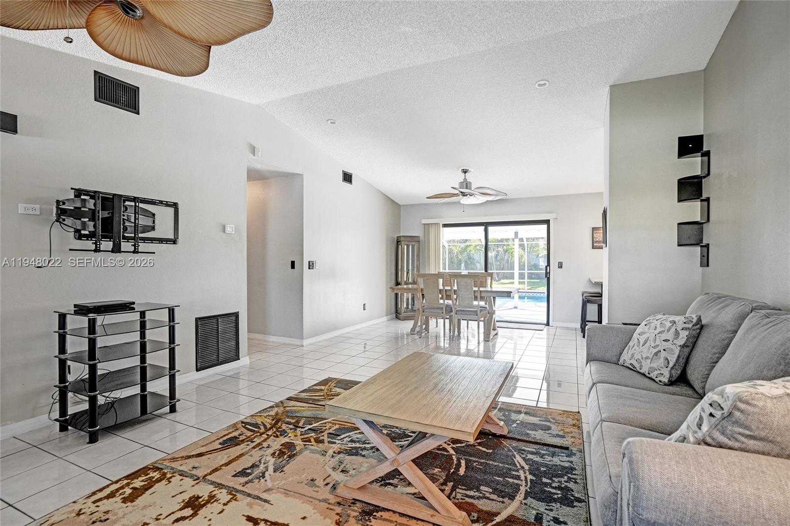 2252 Southeast Rainier Road Port St. Lucie, FL 34952 - Photo 10 of 52 a living room with furniture and wooden floor