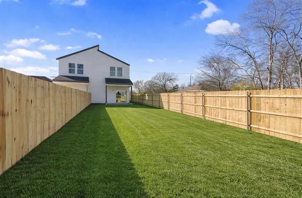 a view of backyard with green space