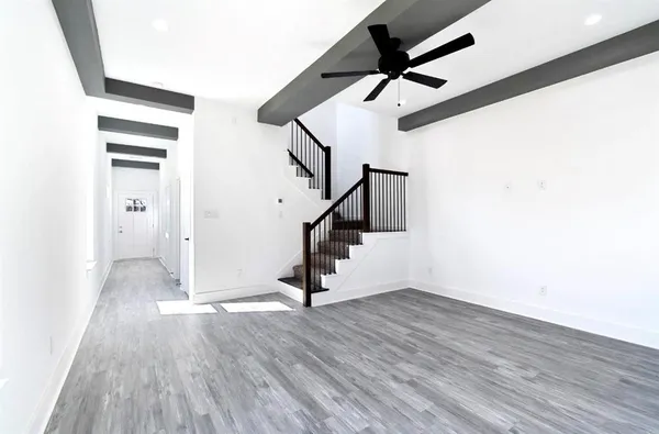 a view of an entryway with wooden floor