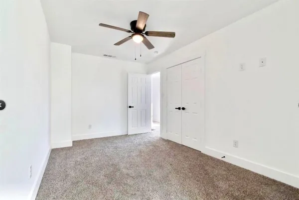 a view of a ceiling fan in a room