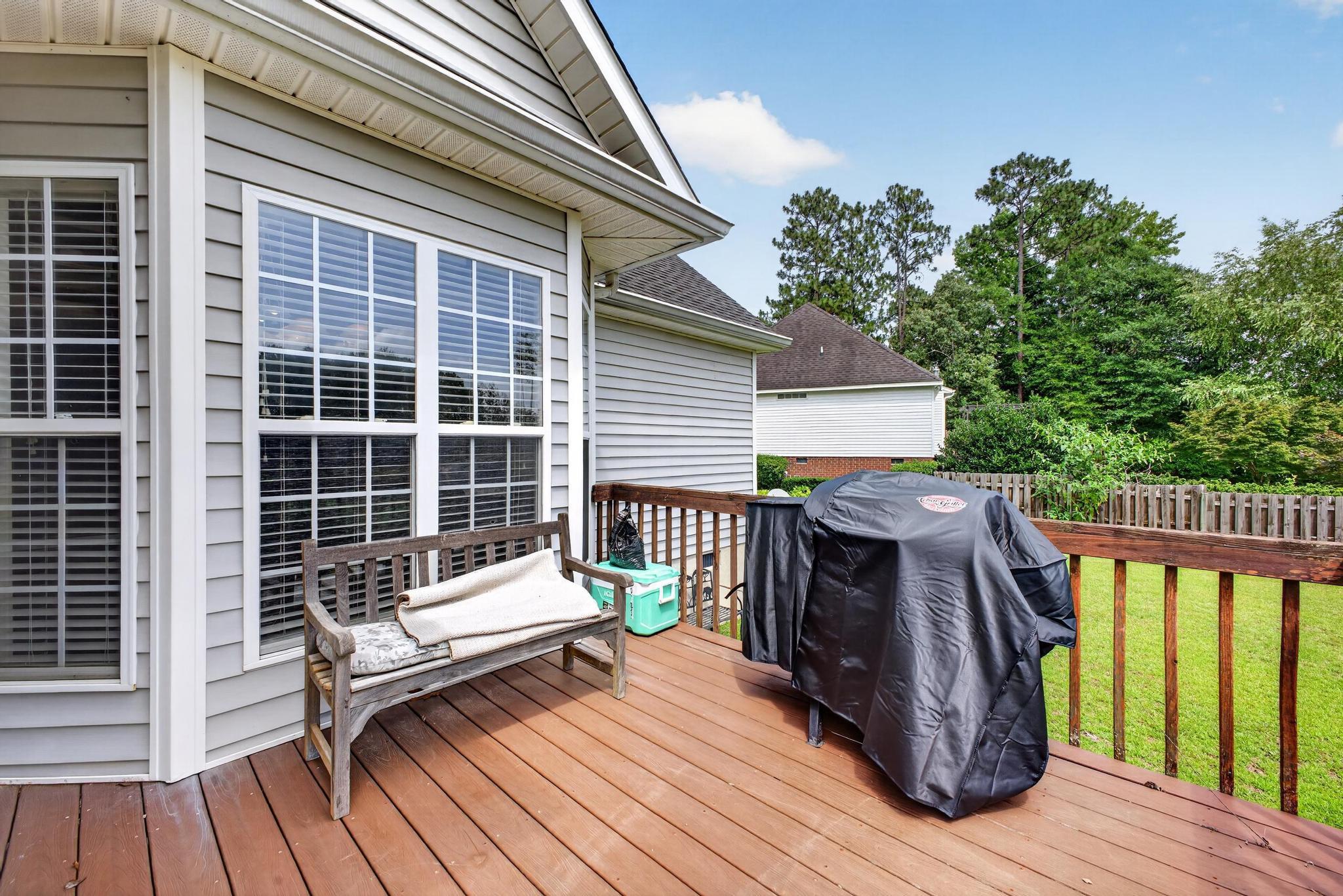 42 Emerald Ridge Aiken, SC 29803 - Photo 26 of 33 a view of a roof deck with wooden floor and fence