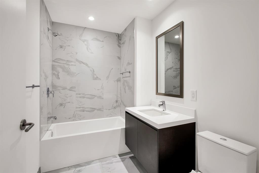 851 Northeast 1st Avenue, Unit 2005 Miami, FL 33132 - Photo 16 of 23 a bathroom with a sink and a mirror