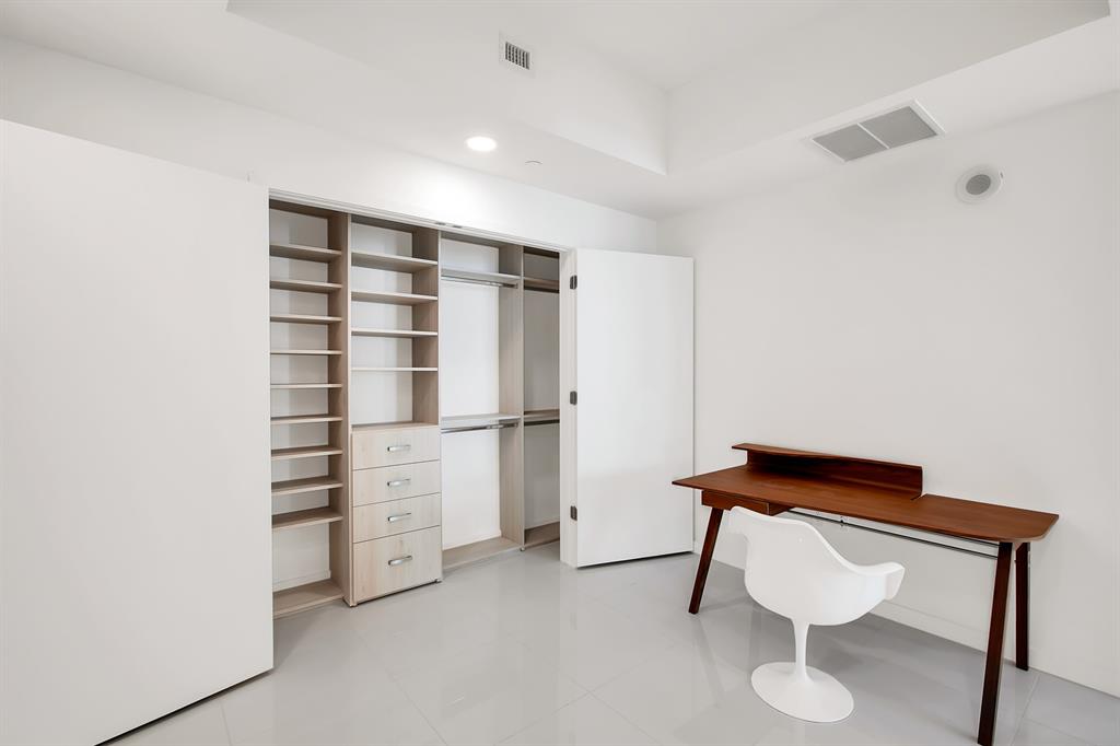 851 Northeast 1st Avenue, Unit 2005 Miami, FL 33132 - Photo 9 of 23 a view of walk in closet with empty racks