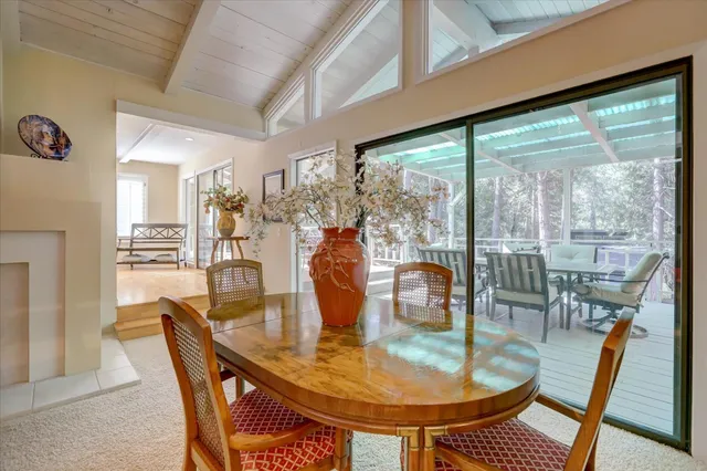a view of a dining room with furniture and window