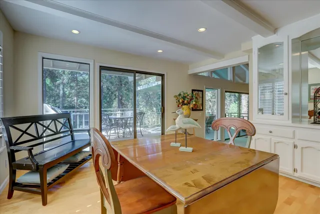 a kitchen with white cabinets stove and sink