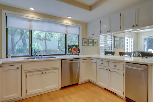 a living room with furniture and a lamp