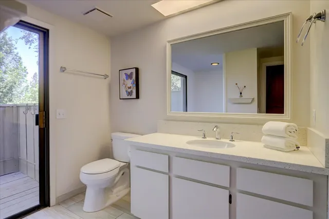 a bedroom with two beds and a window