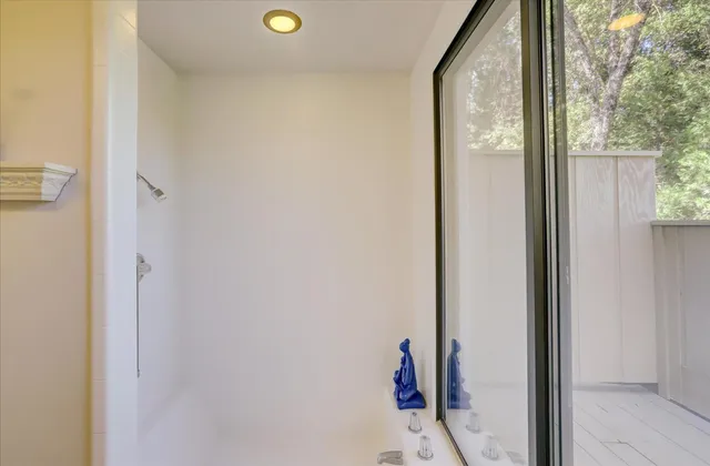 a bedroom with two beds and a window