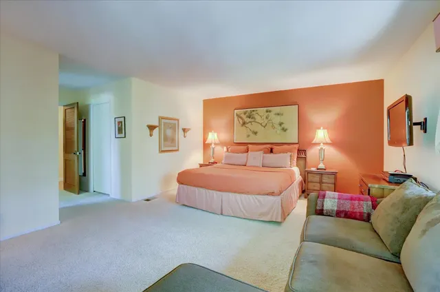 a view of a patio with a table and chairs