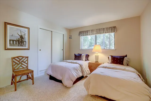 an aerial view of a house with a yard and garden