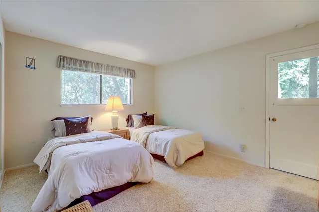 an aerial view of residential house and sandy dunes