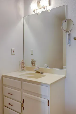 view of a mountain in the distance in a field