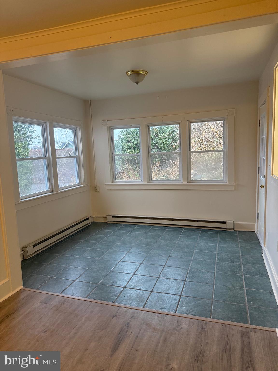 1 Center Street, Unit 2 Port Deposit, MD 21904 - Photo 5 of 7 an empty room with wooden floor and windows