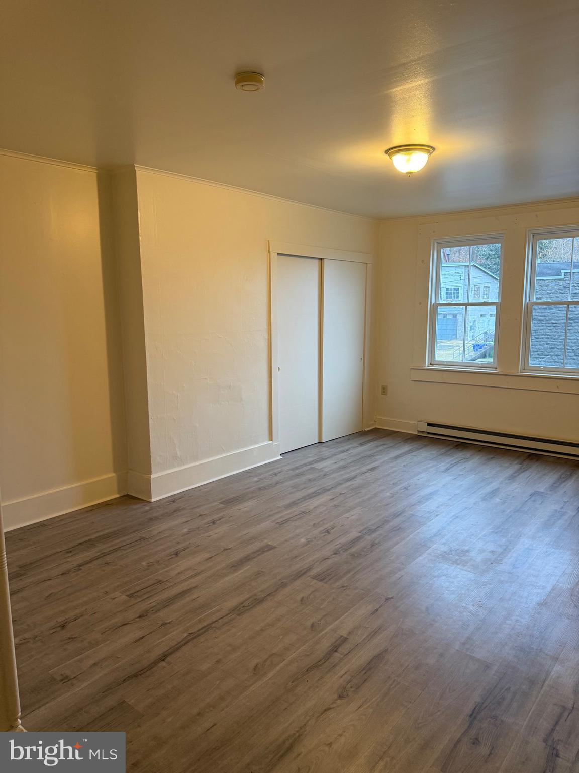 1 Center Street, Unit 2 Port Deposit, MD 21904 - Photo 7 of 7 an empty room with wooden floor and windows