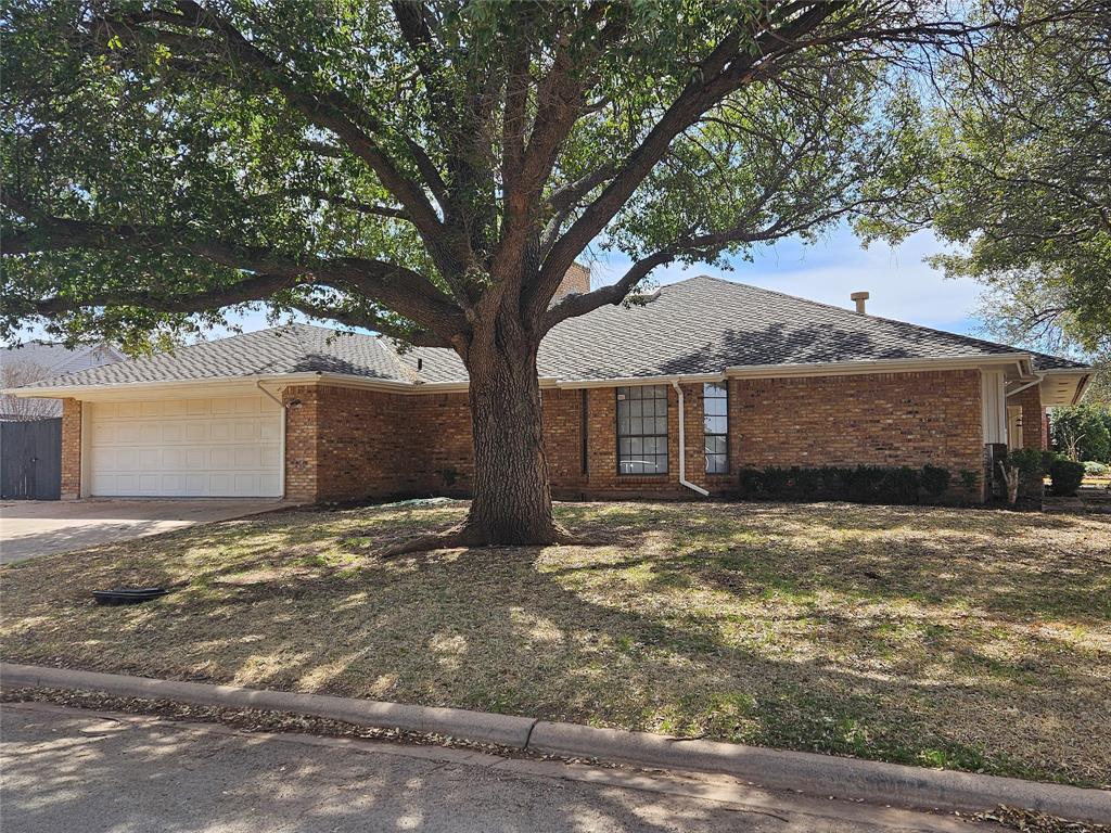 5501 Chimney Rock Road Abilene, TX 79606 - Photo 3 of 14 a view of a house with a yard and garage