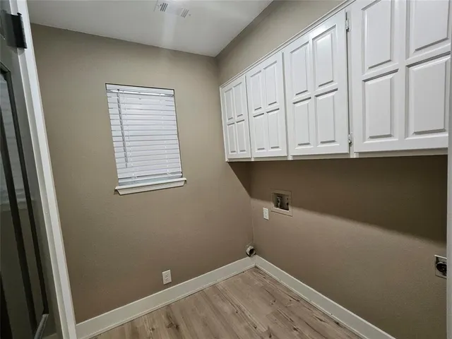 a view of storage and utility room with closet