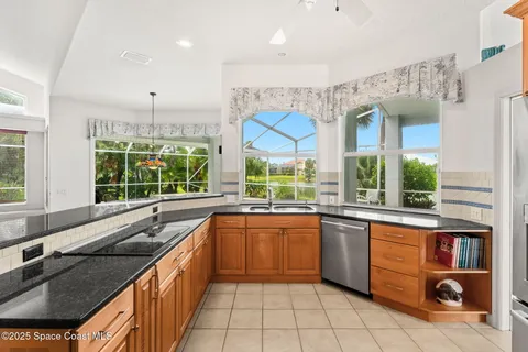 a living room with furniture large window and flat screen tv