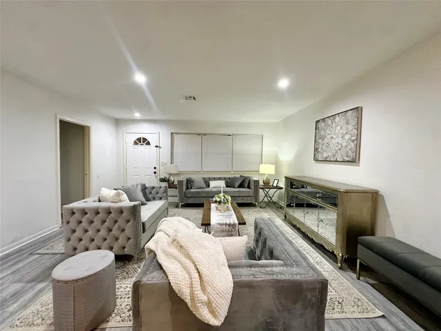 a living room with furniture and a couch