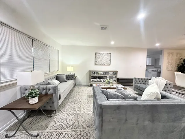 a living room with furniture and a couch
