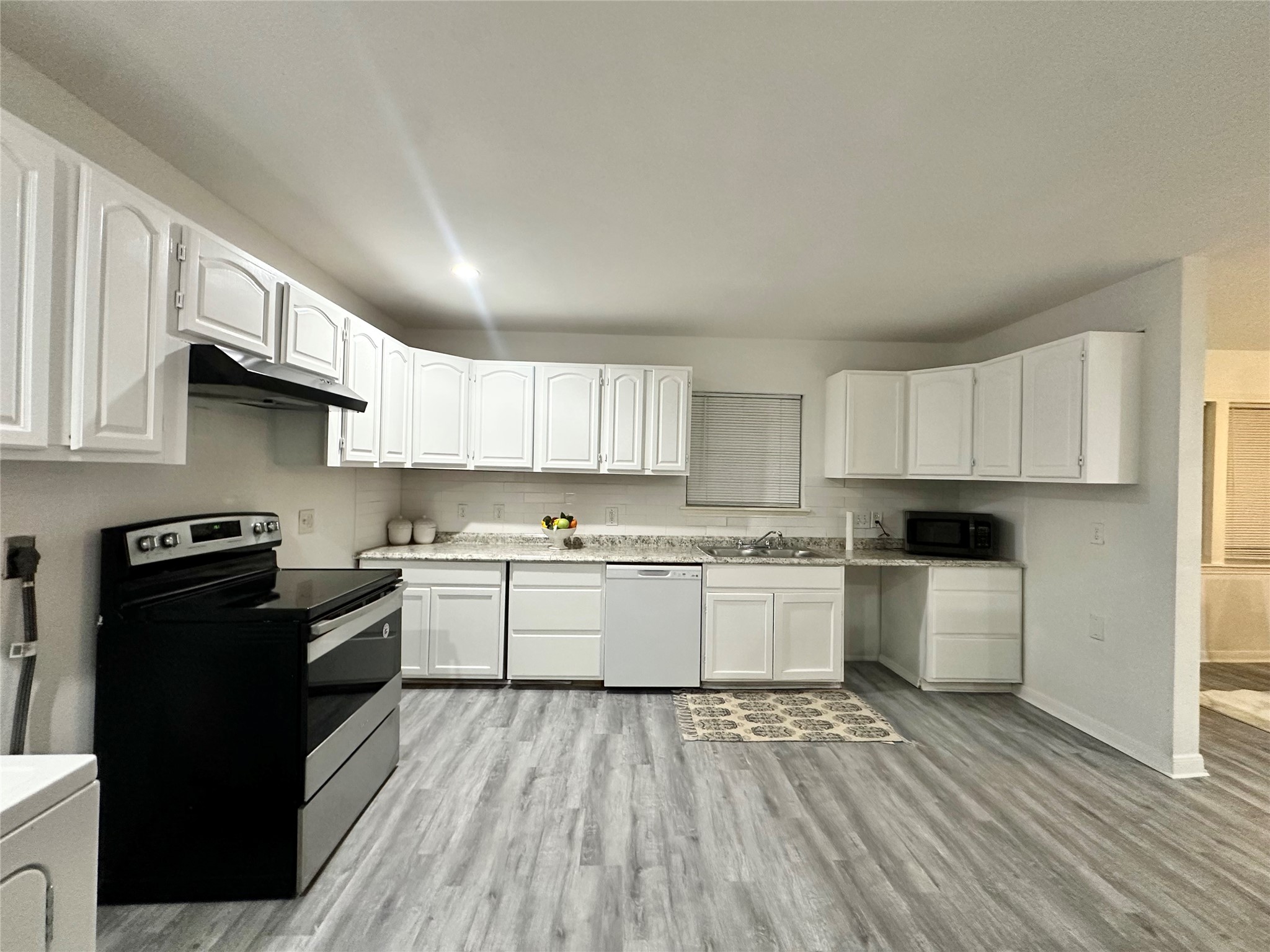 5346 Windswept Lane Houston, TX 77056 - Photo 9 of 20 a kitchen with a sink stove top oven and cabinets