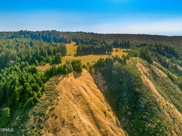 a view of a house with wooden fence