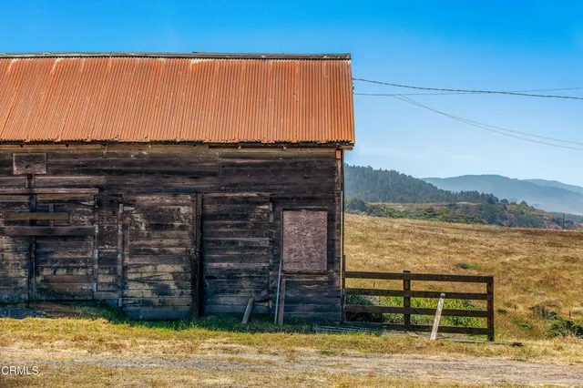 a view of a backyard with a deck
