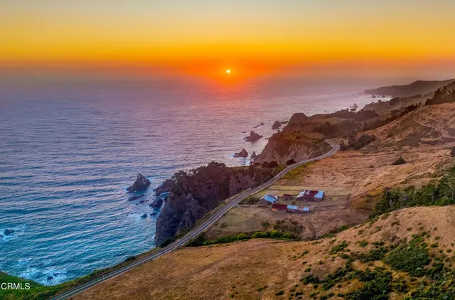 a view of a lake with a yard