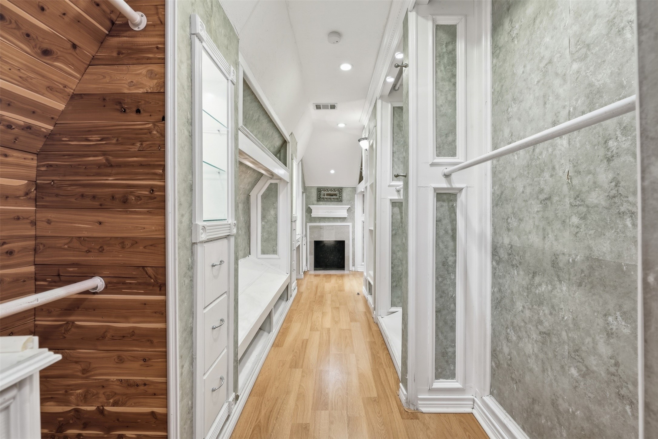 8310 Mentmore Drive Spring, TX 77379 - Photo 30 of 47 A private staircase leads to the incredible primary closet, offering exceptional storage and organization.