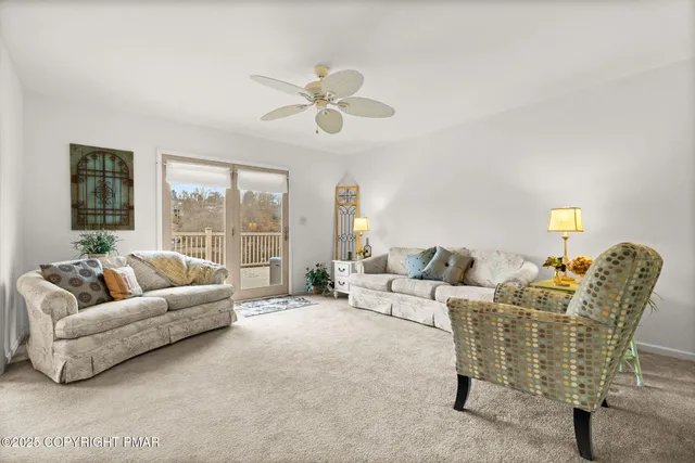 a kitchen with stainless steel appliances granite countertop a stove a sink a dining table and chairs