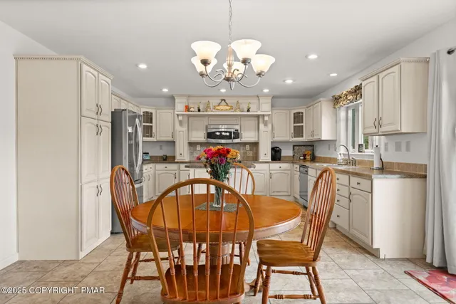 a view of a dining room with furniture window and outside view