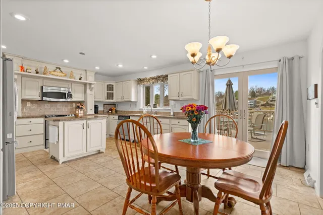 a kitchen with granite countertop cabinets stainless steel appliances and a sink
