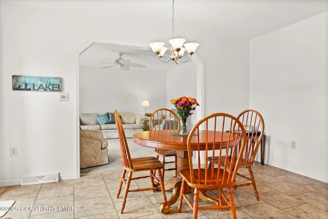 a kitchen with stainless steel appliances granite countertop a stove sink and cabinets