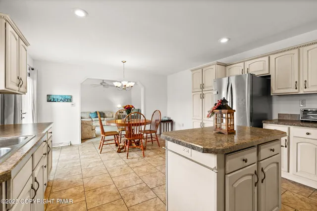 a utility room with sink dryer and washer