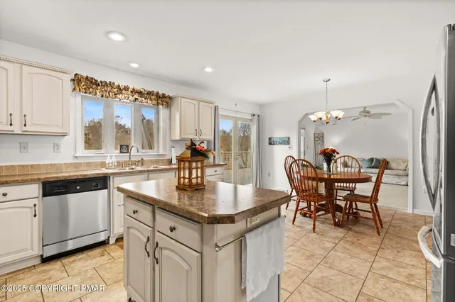 a bedroom with a bed and a chair