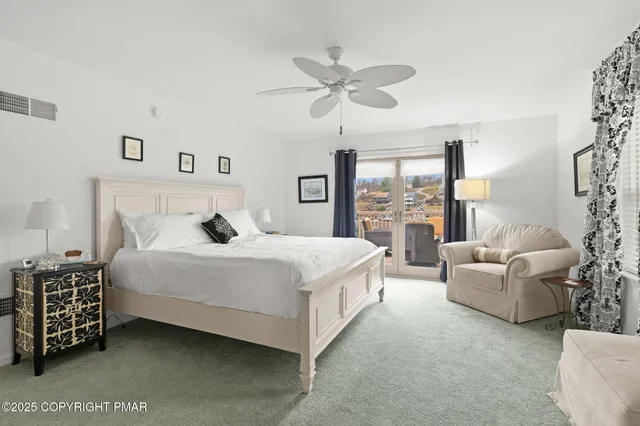 a bedroom with two beds and a desk